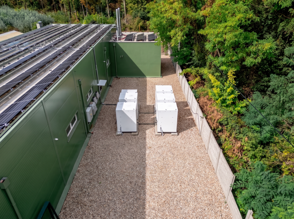Aerial view of the enclosed battery storage compound beside the photovoltaic roof at the Gabčíkovo research station