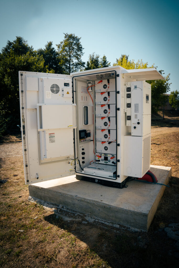 Battery storage cabinet opened to show the internal modules and wiring at Žarnov