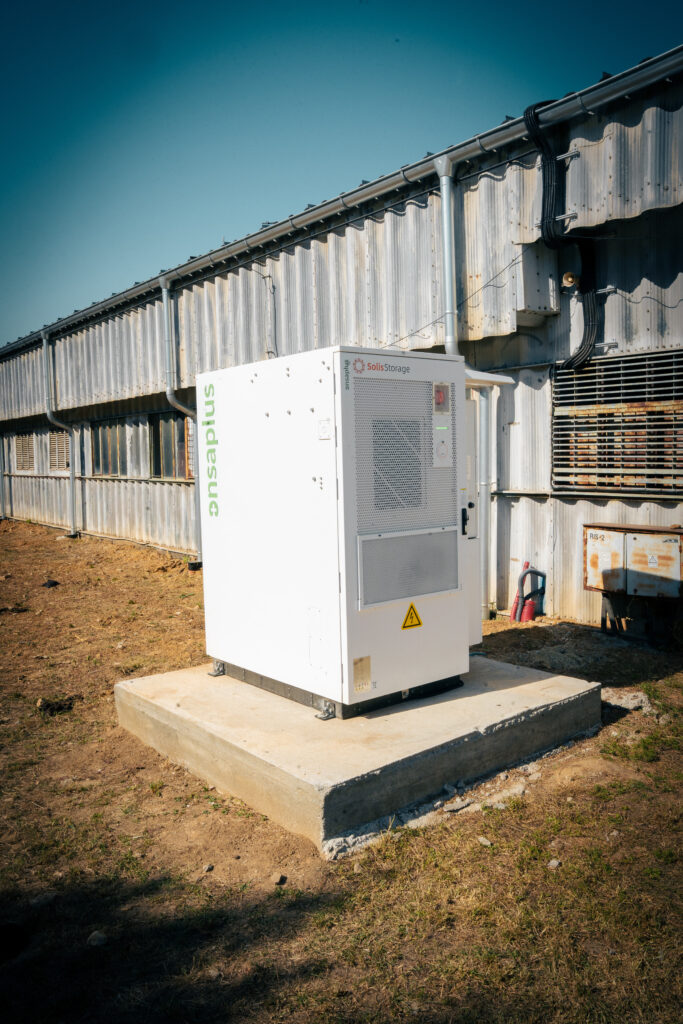 Battery storage cabinet installed along the wall of the farm building in Žarnov